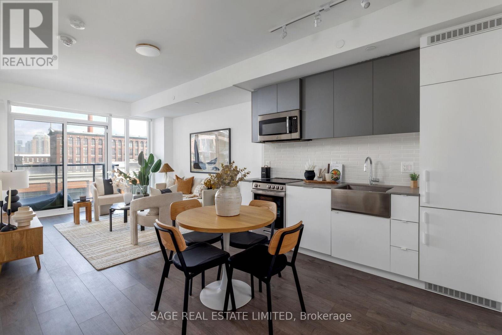 A modern kitchen with a dining table set for four.