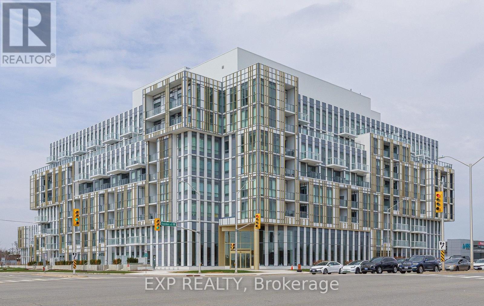 A modern building with a glass facade is shown with EXP REALTY, Brokerage written on the bottom.