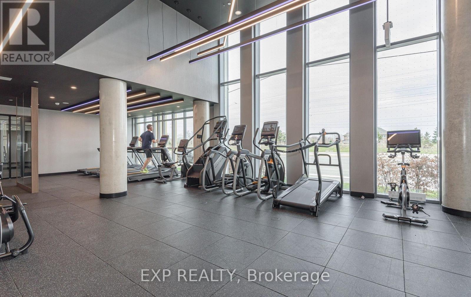 A gym with treadmills, exercise bikes and a rowing machine.