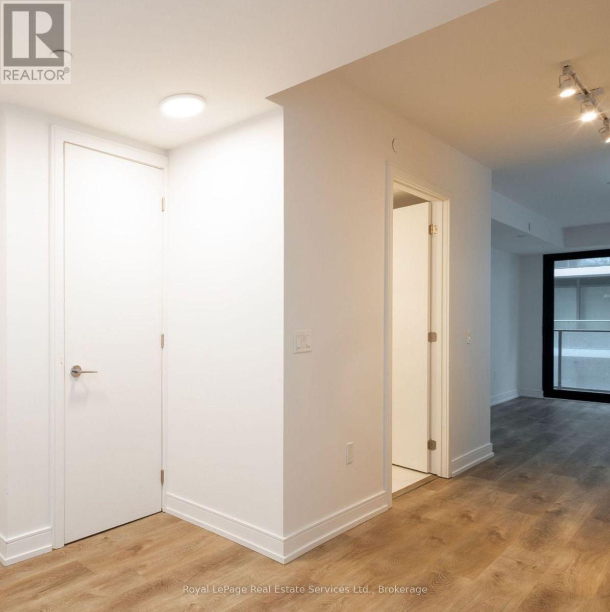 A white door is on the left and a white door is on the right.