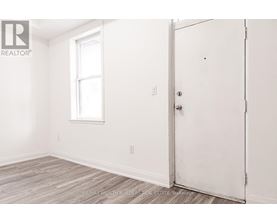 A room with a door and a window.