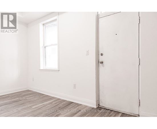 A room with a door and a window.
