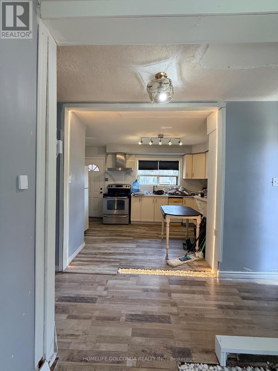 A kitchen with a table and chairs in the middle of the room.