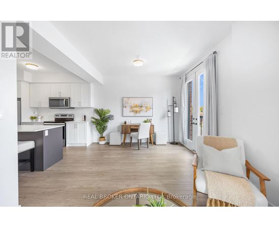 A well-lit, spacious kitchen and living room with modern furnishings.