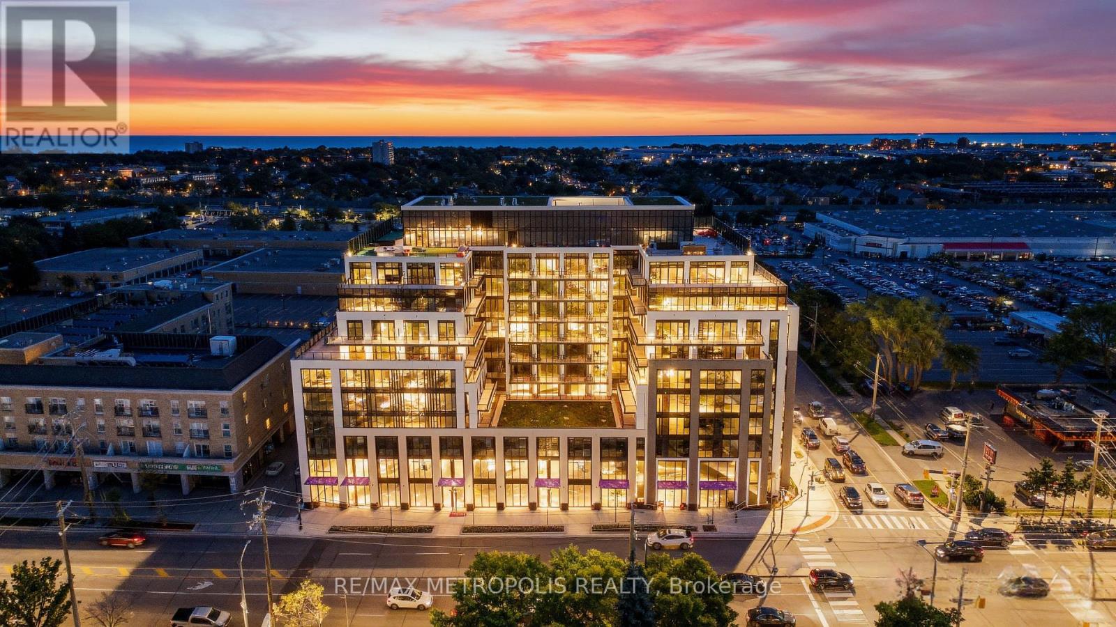 A modern building with a glass facade is the focal point of the image, surrounded by a bustling cityscape.