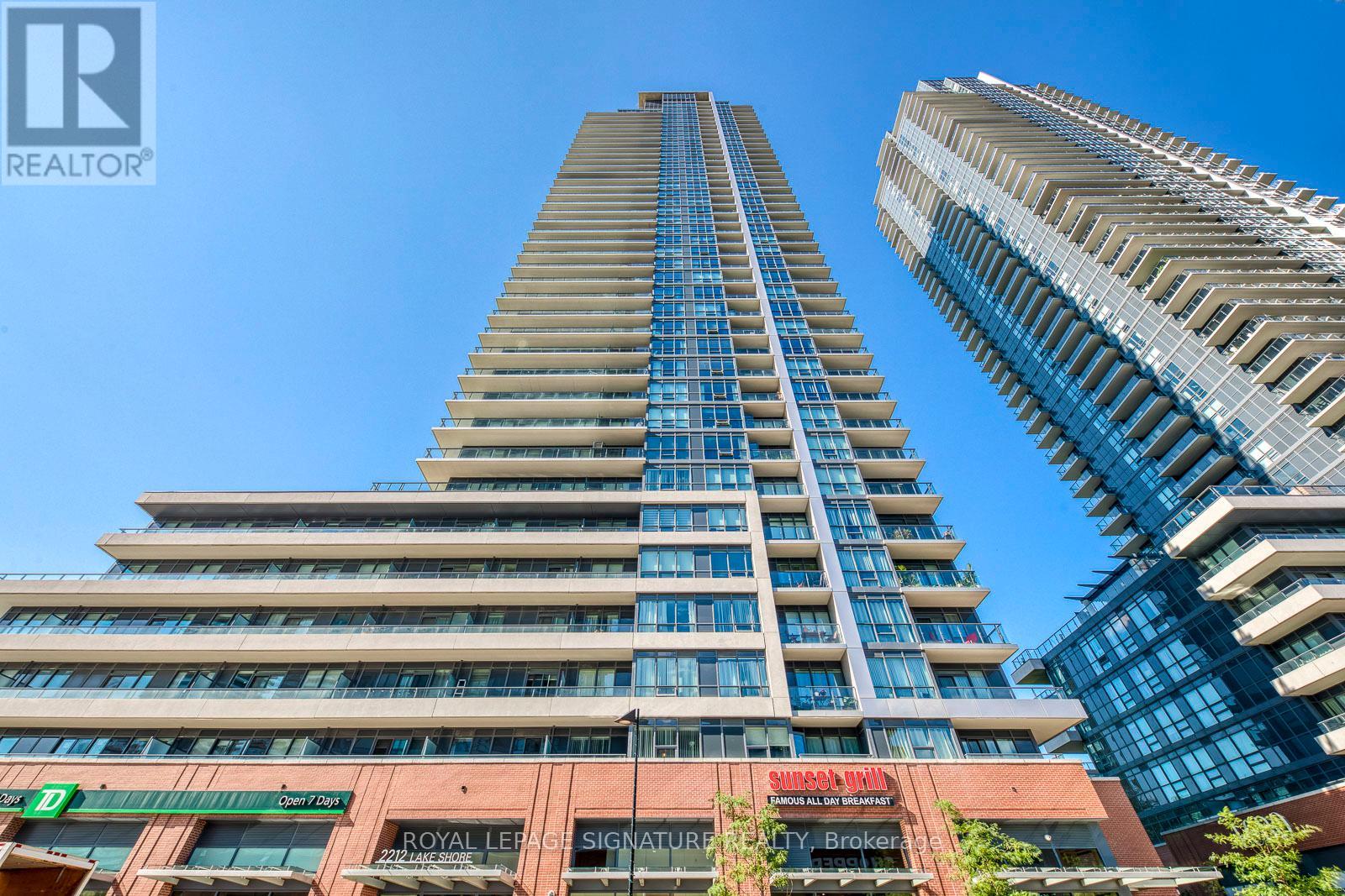 A tall building with a blue sky in the background.