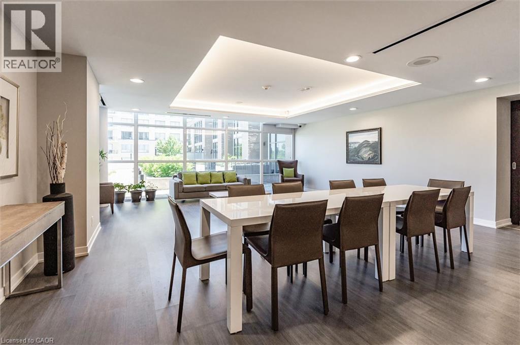 A modern dining room with a long table and chairs.