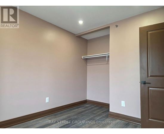 A room with a door and a shelf in it.