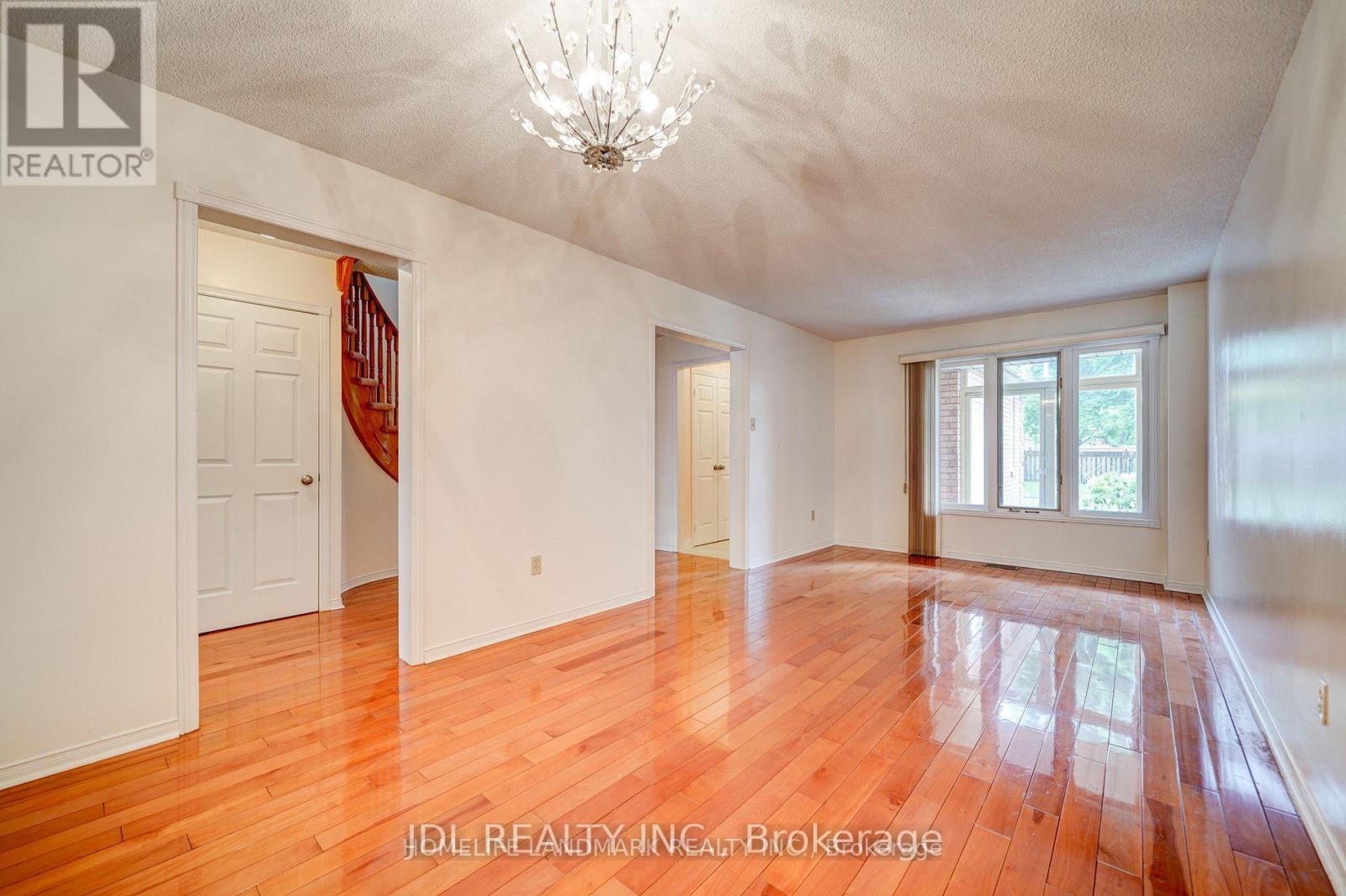 A room with wooden floors and white walls.