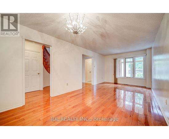 A room with wooden floors and white walls.