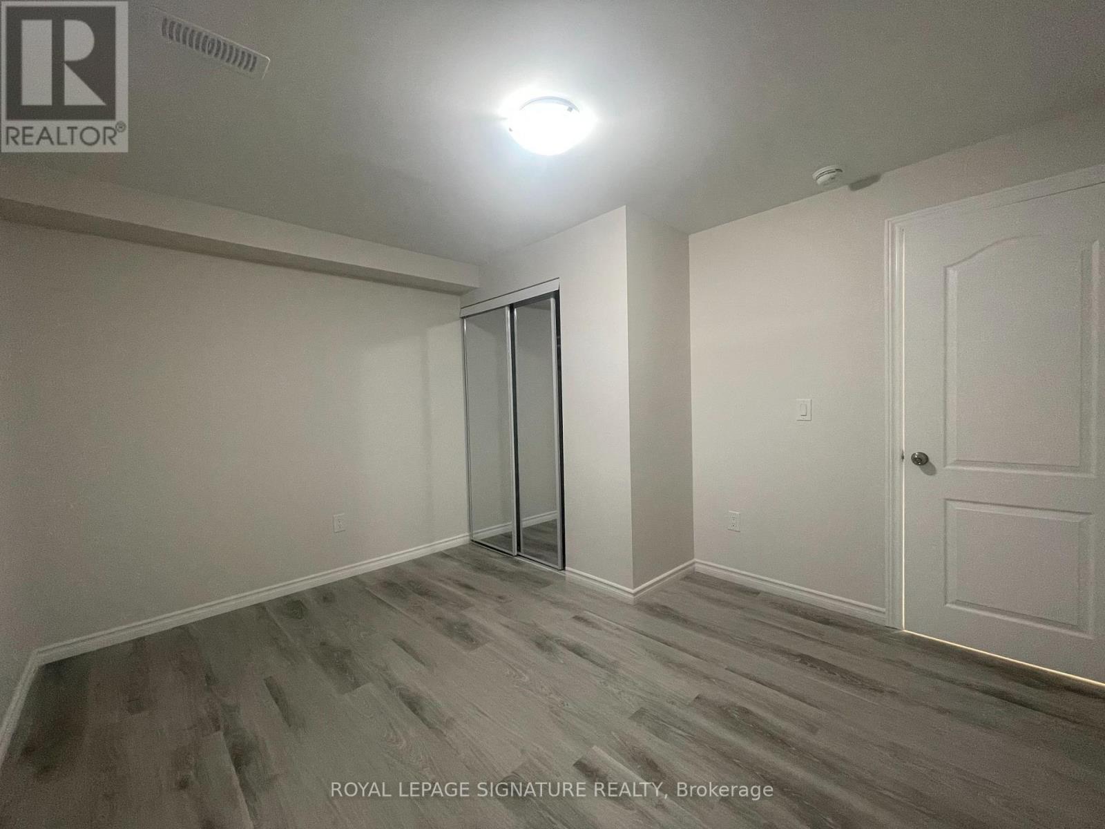 A room with a white door and a glass door.