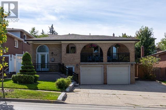 A house with a garage and a driveway is for sale.