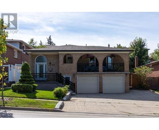 A house with a garage and a driveway is for sale.