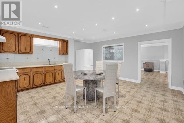 A dining room with a table and chairs is shown.