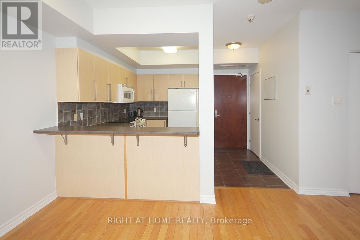 A kitchen with a counter top and cabinets.