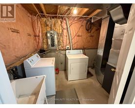 A laundry room with a washer and dryer.