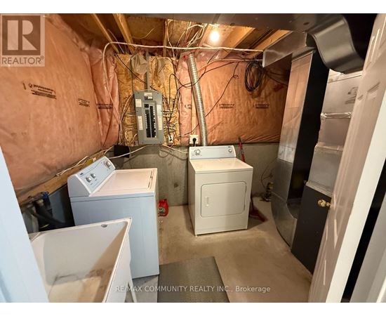 A laundry room with a washer and dryer.