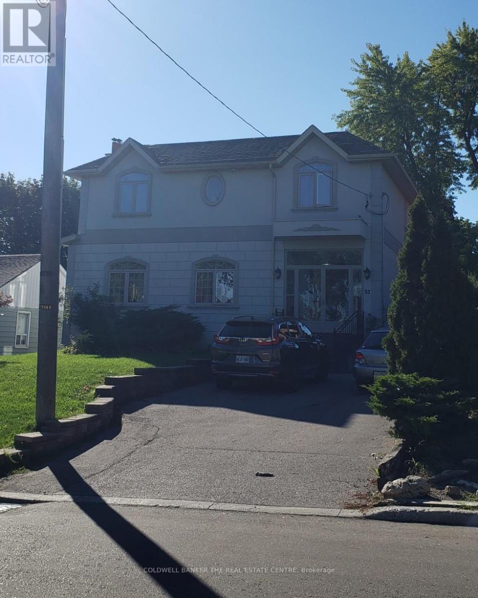 A house with a car parked in front of it.