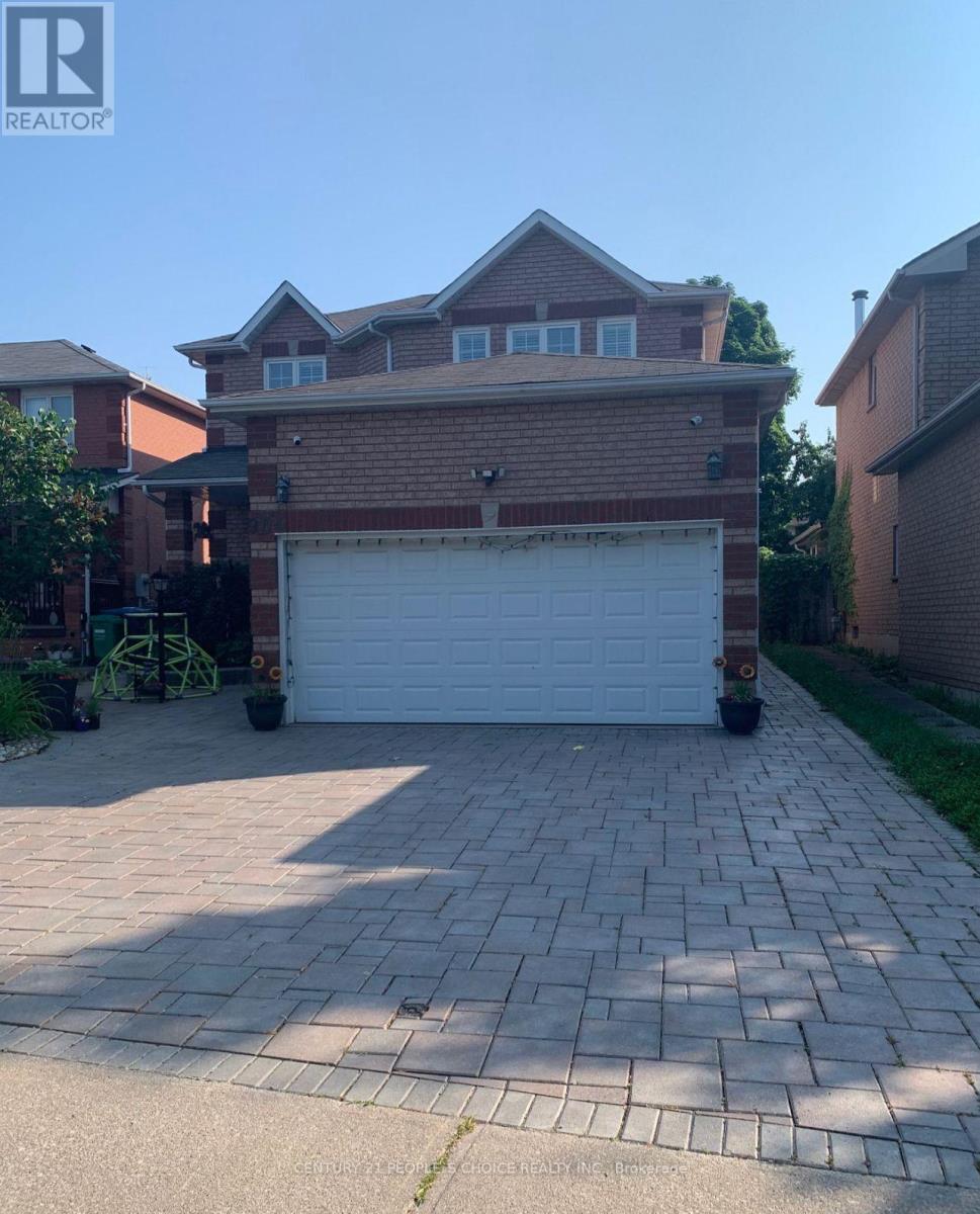 A house with a garage in front of it.