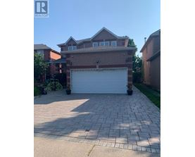 A house with a garage in front of it.