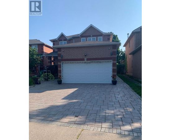 A house with a garage in front of it.
