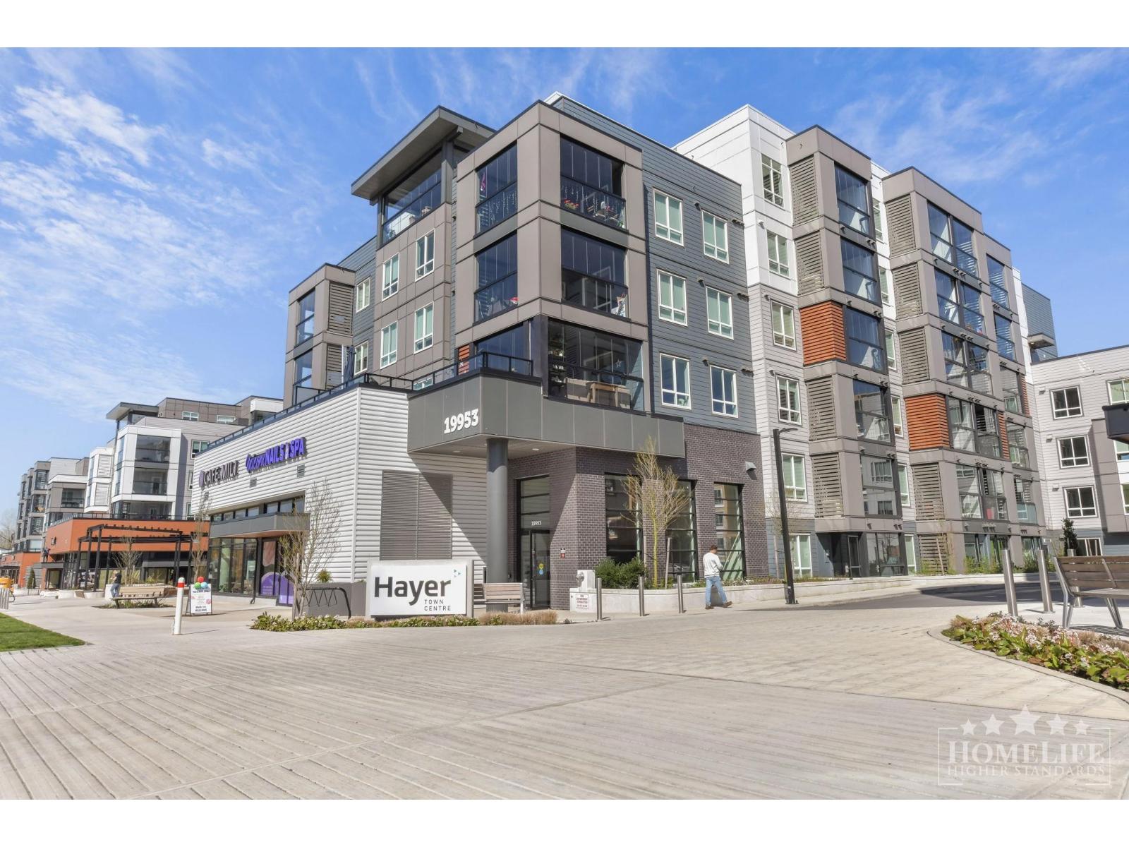A modern multi-story building with the name "Hayer" prominently displayed on the front.