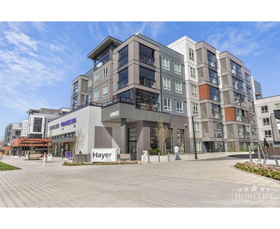 A modern multi-story building with the name "Hayer" prominently displayed on the front.