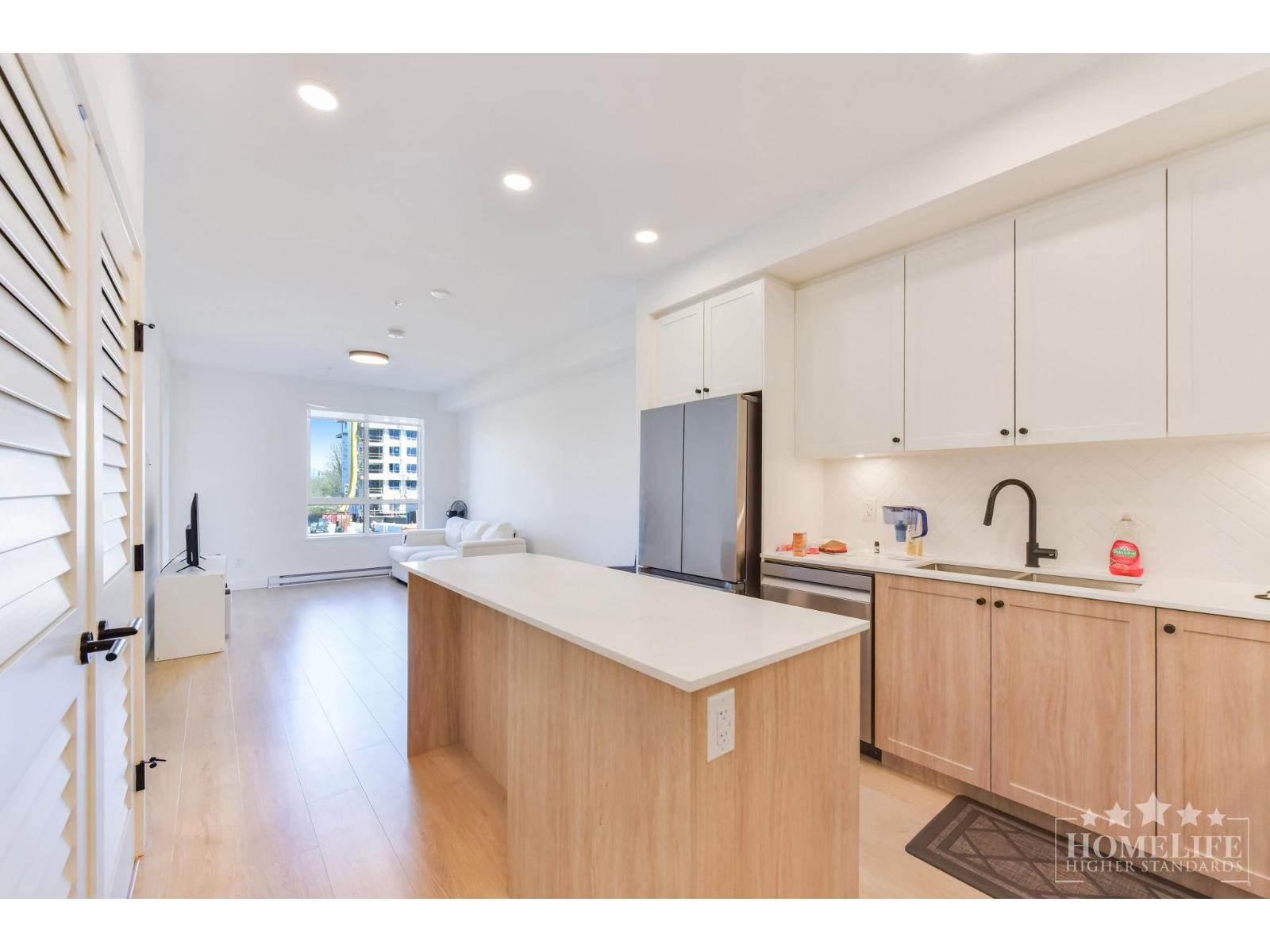 A kitchen with wooden cabinets and a white counter top.