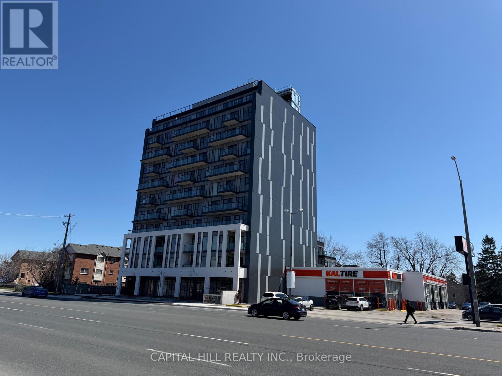 A tall building with a sign that says "KALTURE" on the side of it.