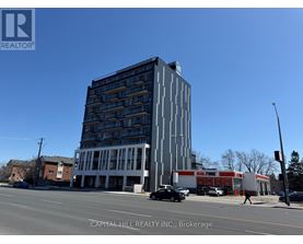 A tall building with a sign that says "KALTURE" on the side of it.