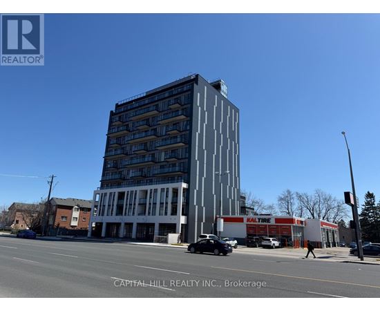 A tall building with a sign that says "KALTURE" on the side of it.
