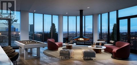 A modern living room with a pool table and a fireplace.