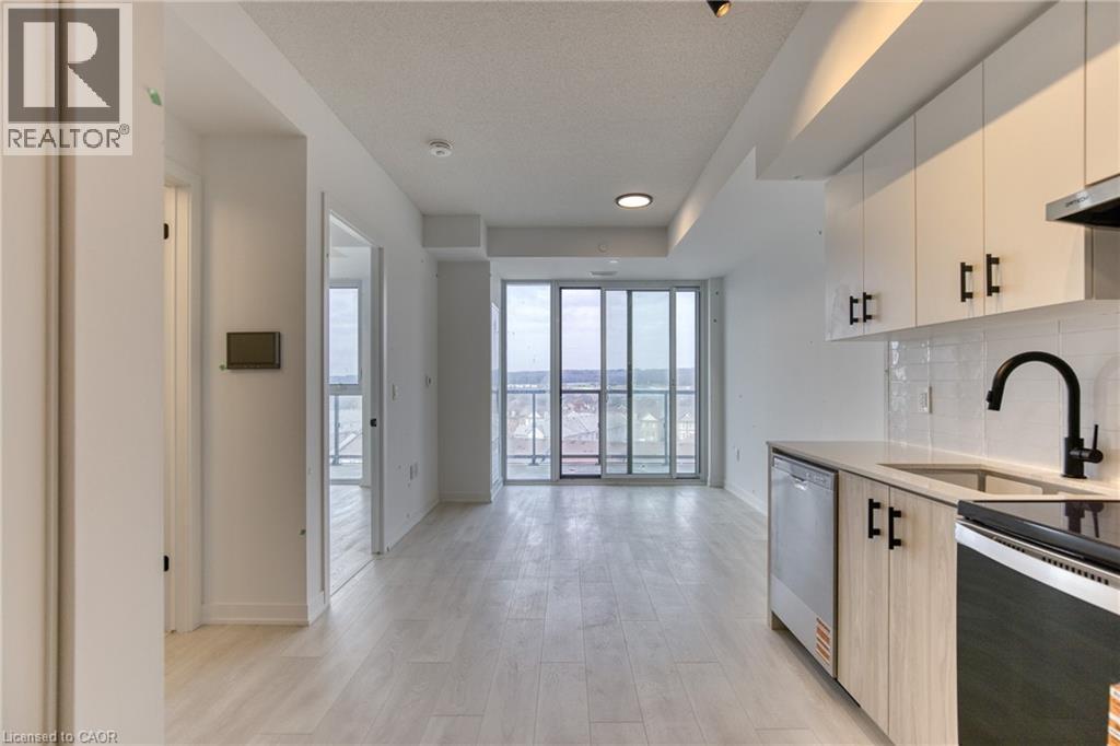A modern kitchen with a microwave oven and a sink.