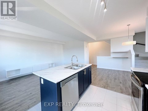 A kitchen with a sink and a counter top.