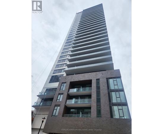 A tall residential building with balconies and a sign that reads "HOMELIFE SUPERSTERS REAL ESTATE LIMITED.".
