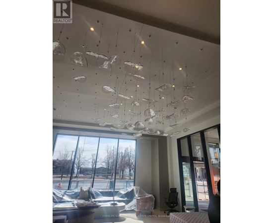 A modern interior with a glass ceiling and a view of the outdoors.