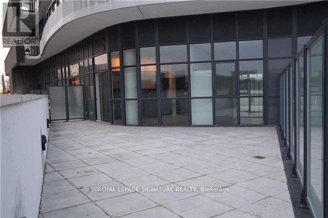 A building with glass walls and a sign that says "Royal LePage Signature Realty Brokerage".