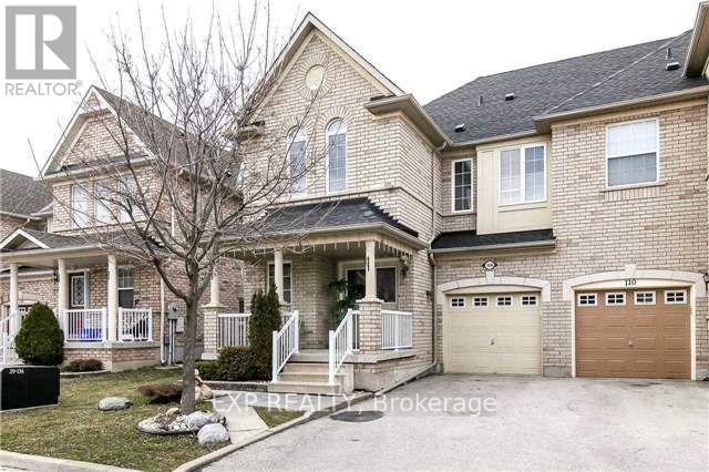 A two-story house with a garage is for sale.