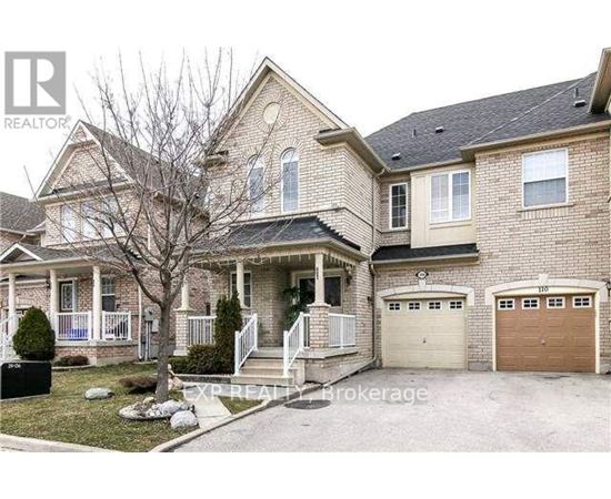A two-story house with a garage is for sale.