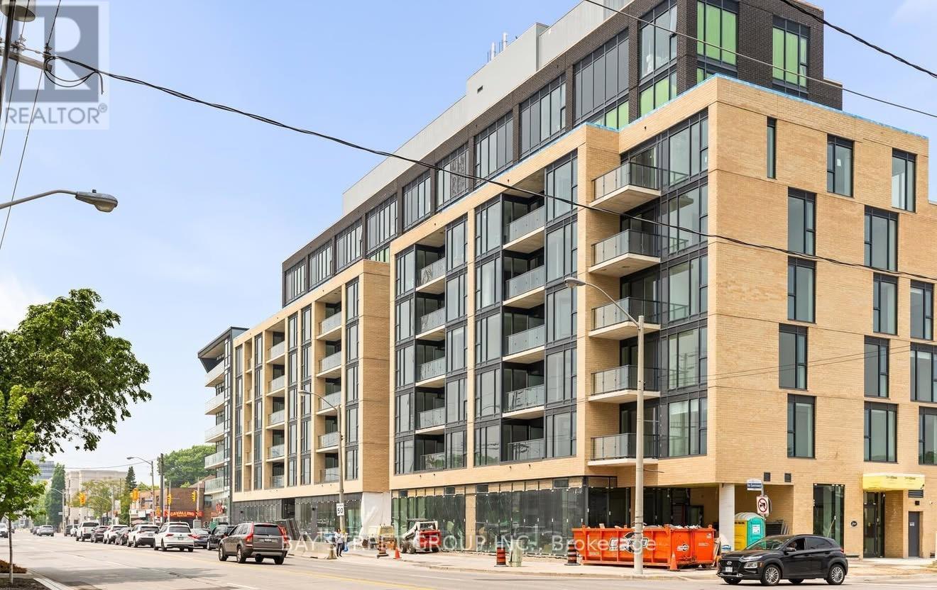 A large multi-story building with a lot of windows and balconies.