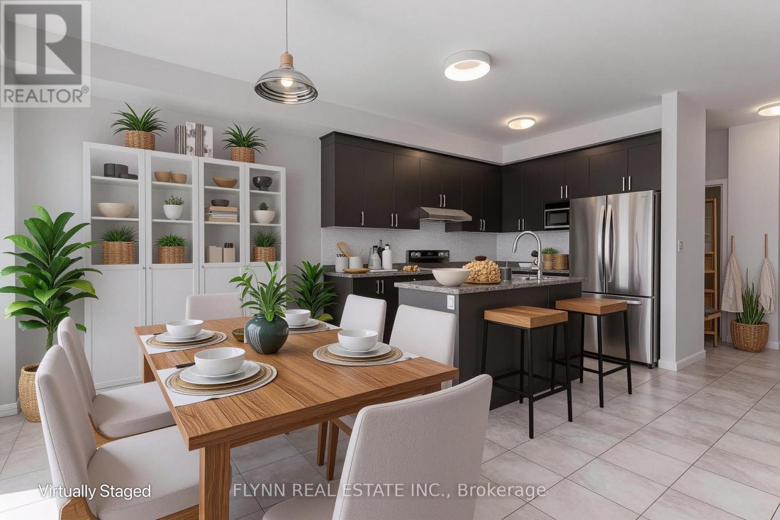 A modern kitchen with a dining table set for two.