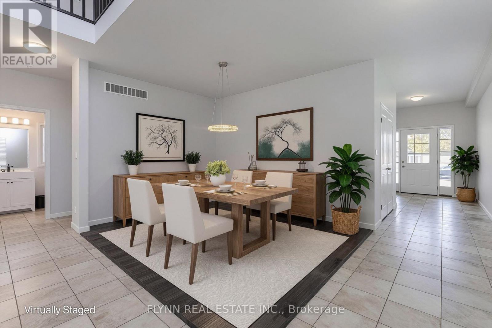 A dining room with a wooden table and chairs.