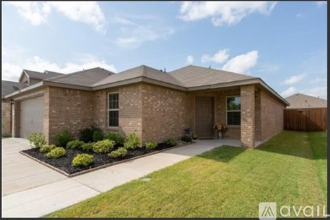 A house with a brown brick exterior and a well-maintained lawn.