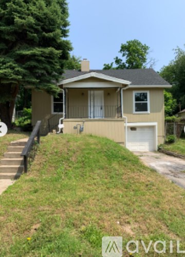 A house with a white garage door is for sale.