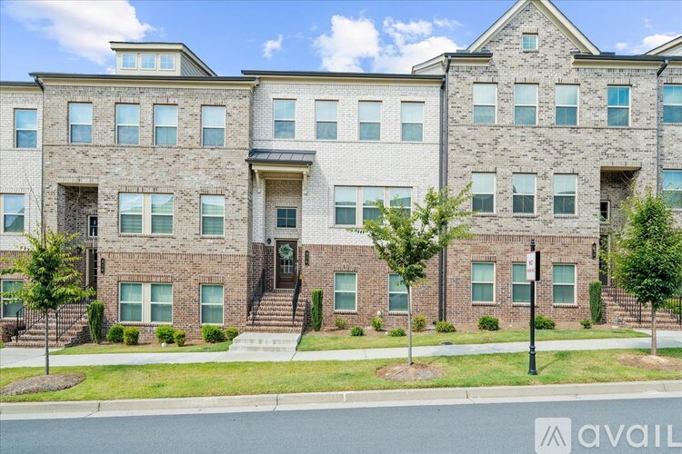 A large brick apartment building with multiple windows and doors.