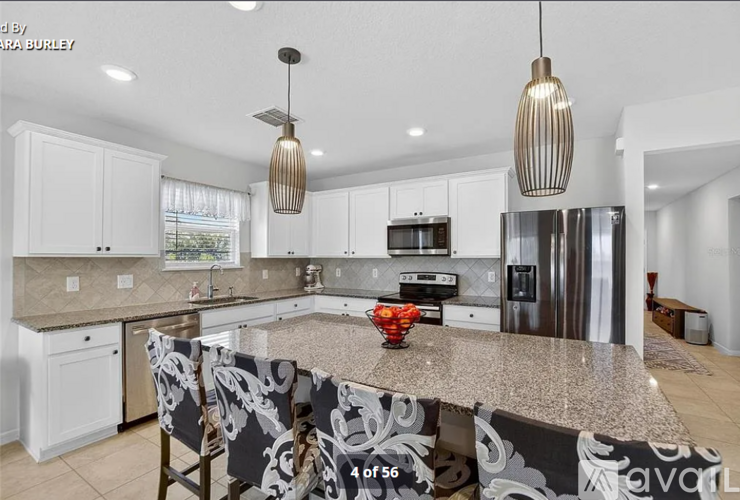 A kitchen with a granite countertop and a sink.