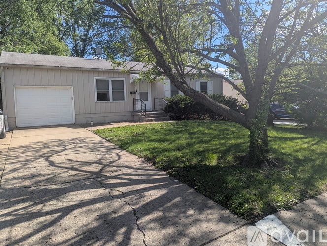 A house with a tree in front of it.