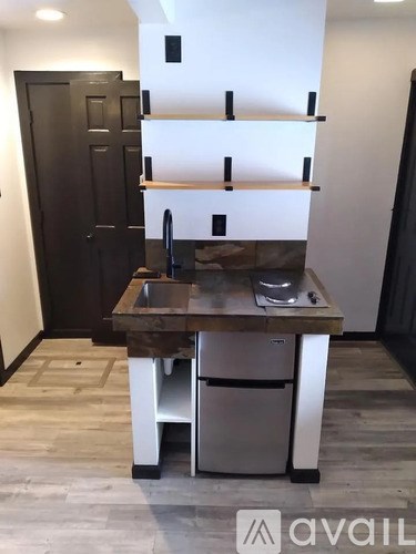 A kitchen with a sink and a dishwasher.
