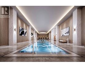 A long, narrow indoor swimming pool with a light blue color.