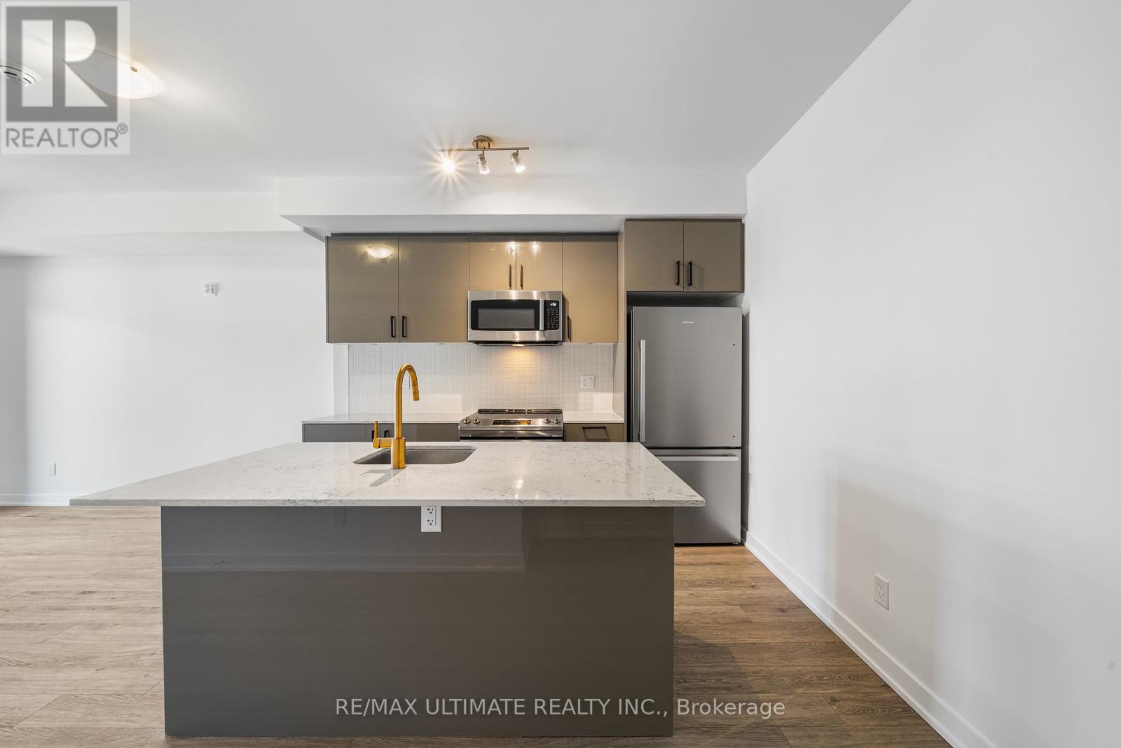 A modern kitchen with a large island in the middle.